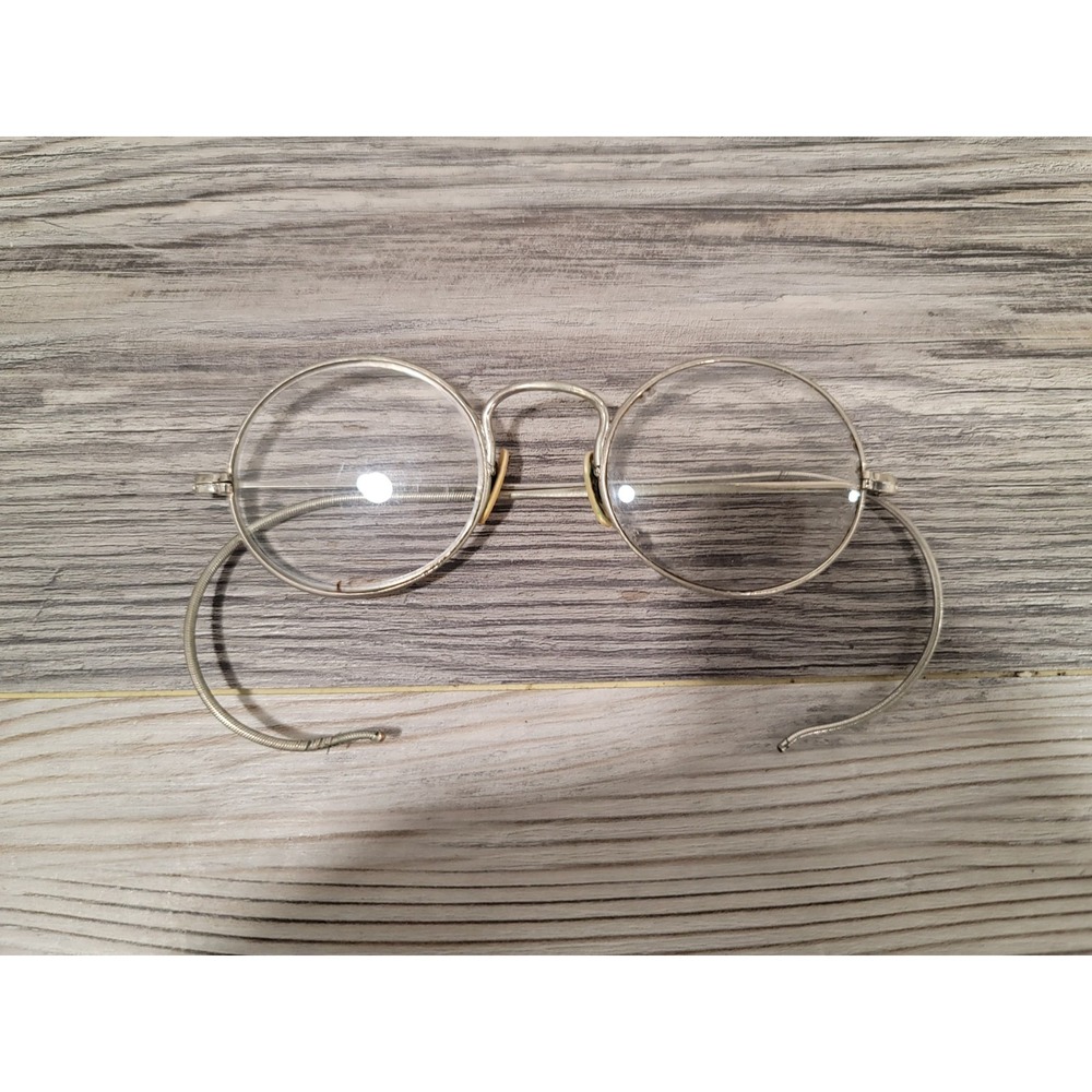 Antique round glasses silver wired 19th century chip on inside left lenses